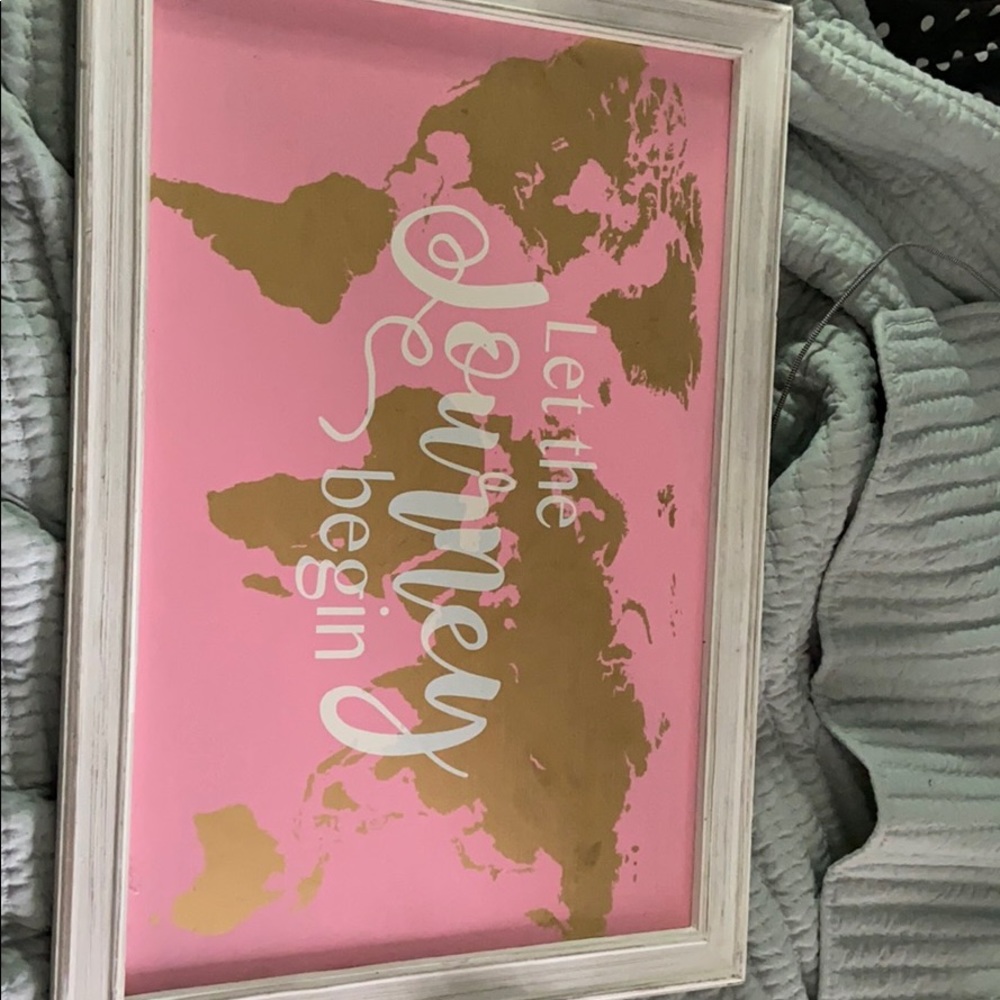 “Let the journey begin” sign